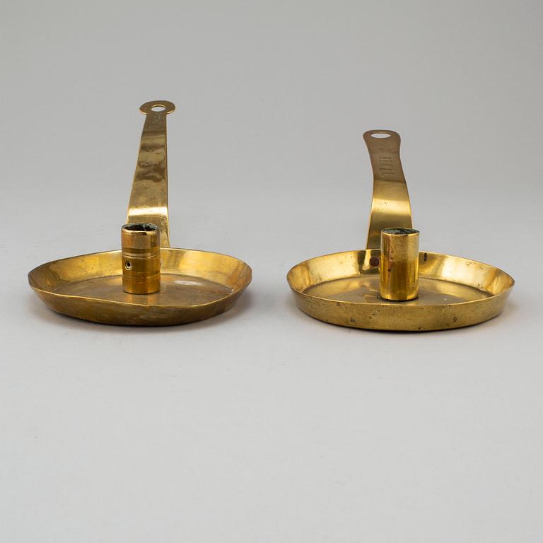 Two 18th century brass candlesticks.