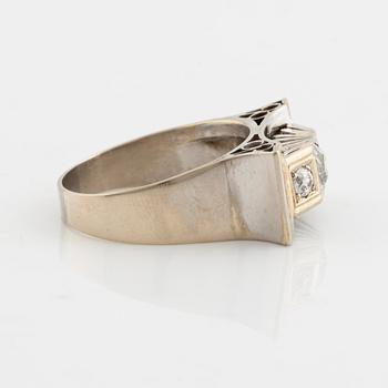 A 14K gold ring set with old-cut diamonds.