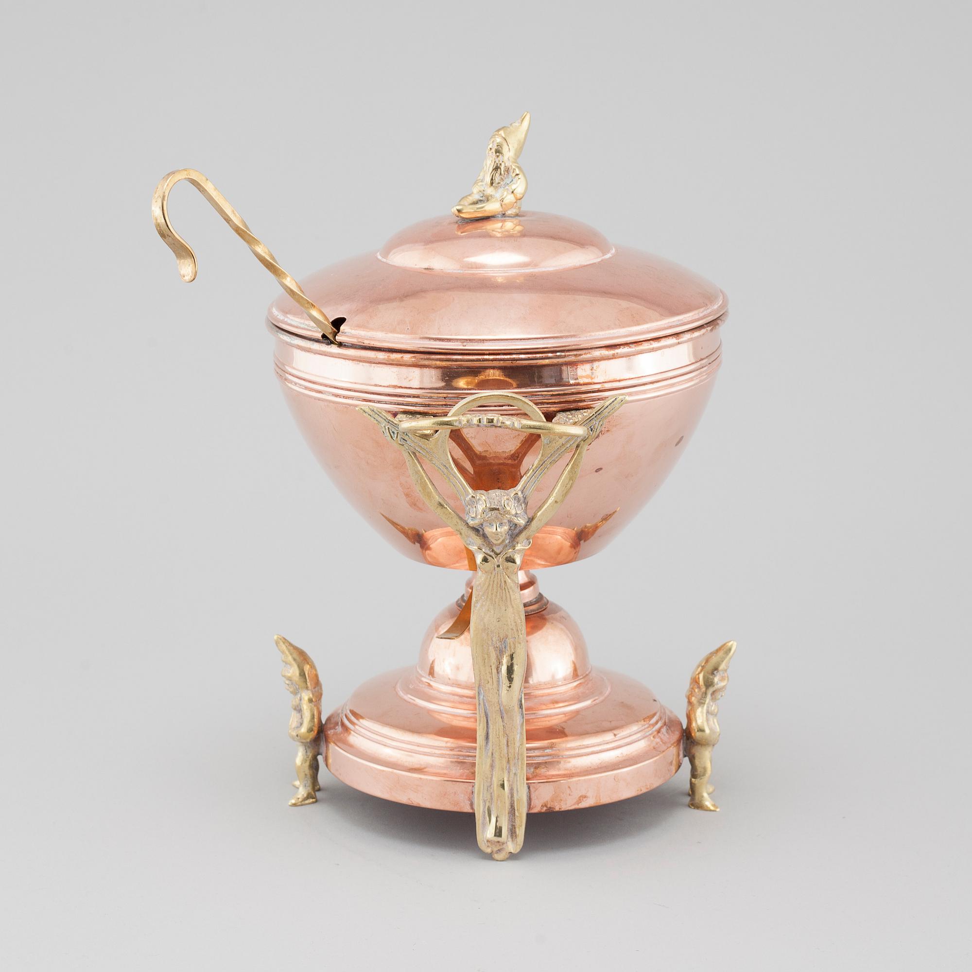 An early 20th century mulled wine heater.