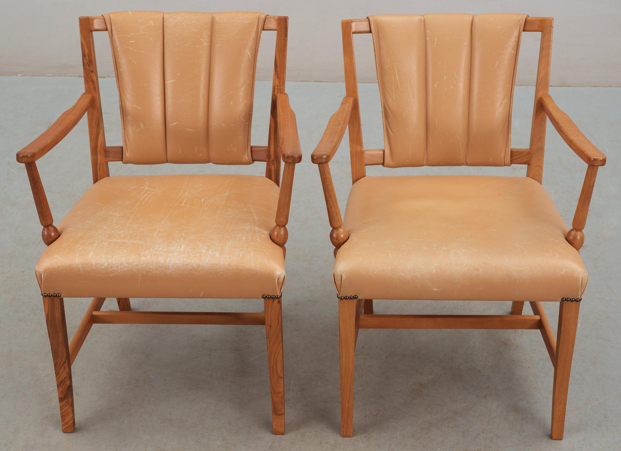 A pair of Josef Frank walnut and light brown leather armchairs, Svenskt Tenn.
