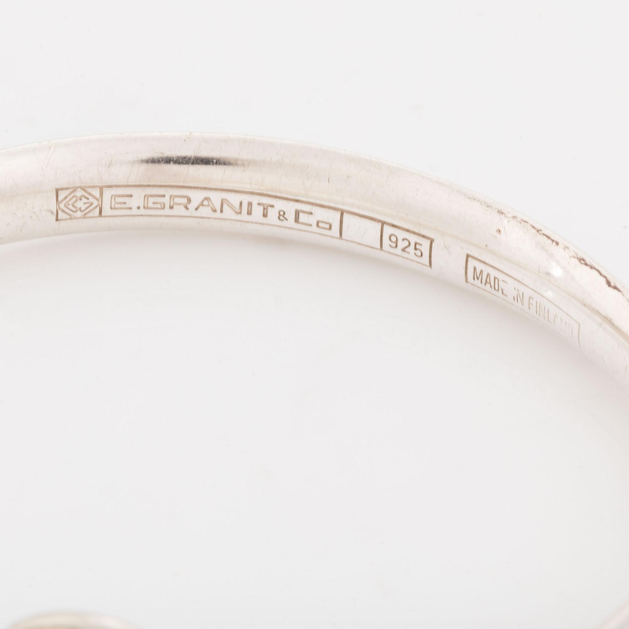 A silver Erik Granit bracelet.