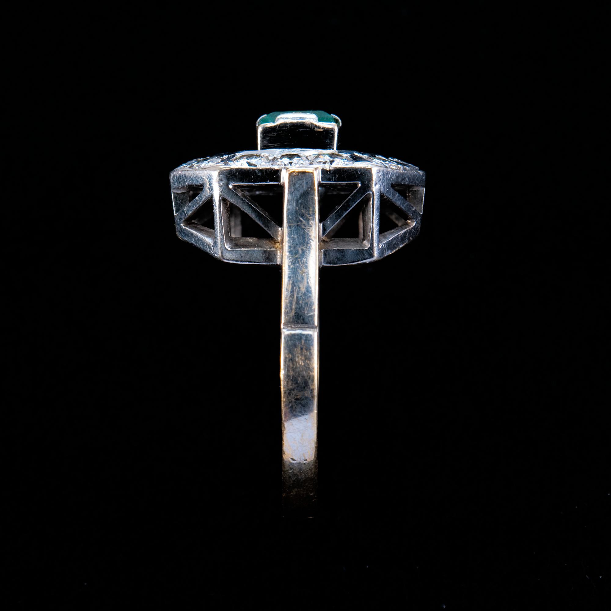 A RING, emerald c. 0.55 ct and diamonds c. 0.70 ct.