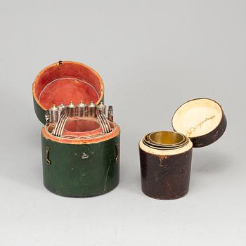 Two Swedish early 19th century boxes with silver beakers and cutlery, mark of JF Bjornstedt, Stockholm 1815.