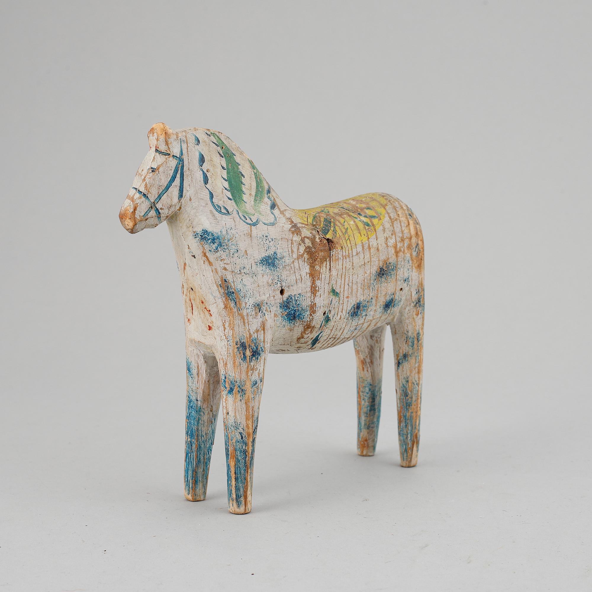 A painted Swedish wooden horse from the early 20th century.