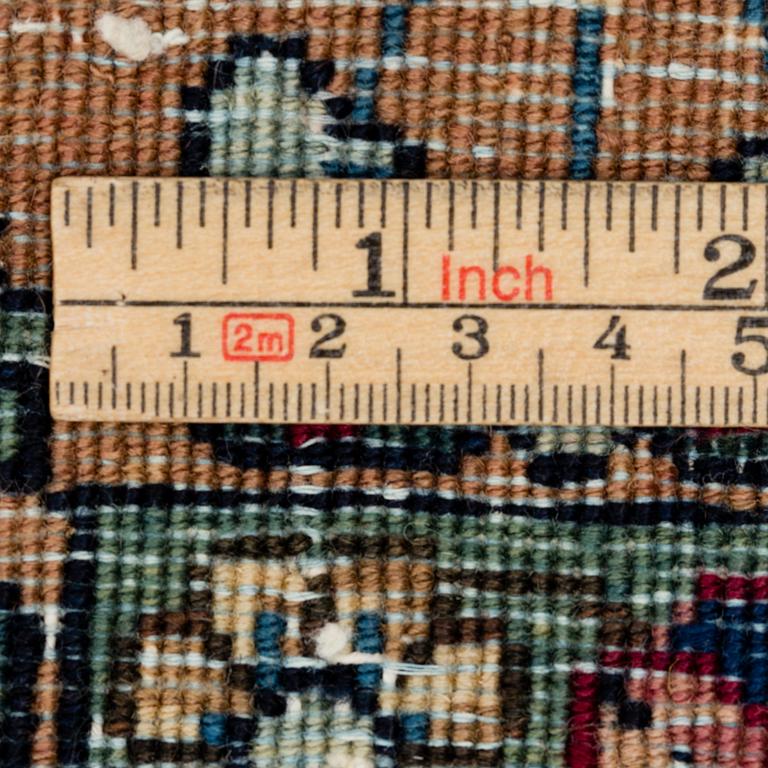 A semi-antique carpet from Kerman, 346 x 273 cm.