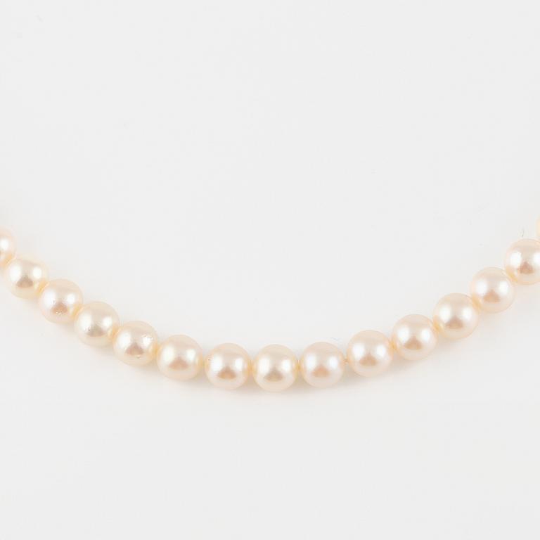 Three strands of cultured pearls, without clasps.