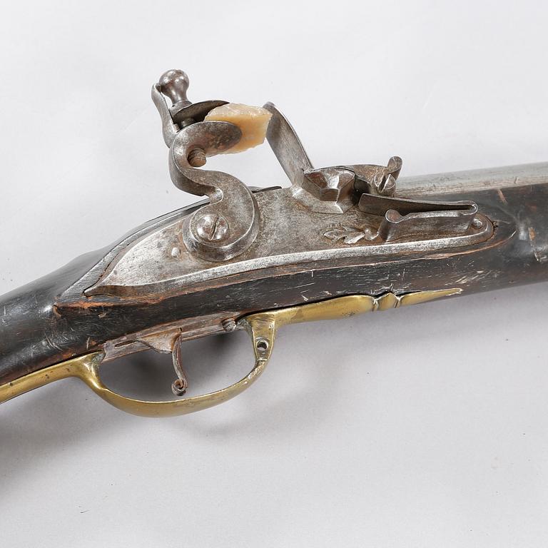 A flintlock rifle, 18th century.