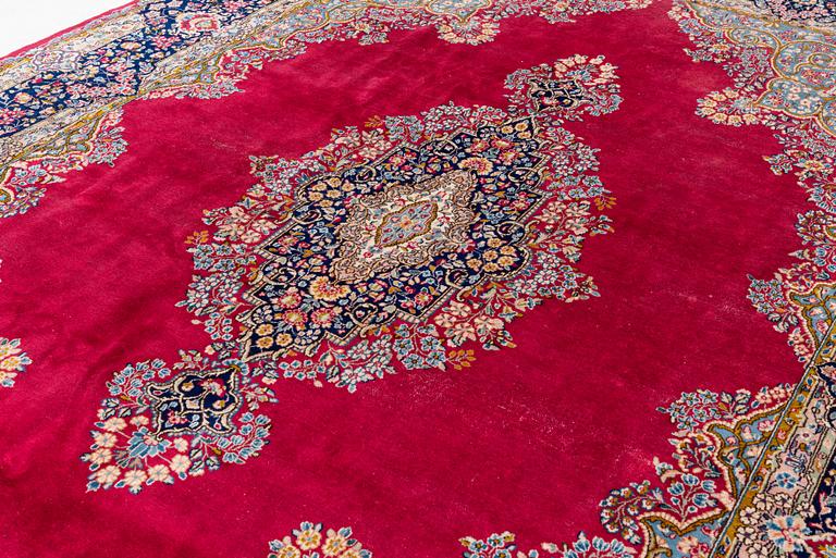 A Kirman carpet, signed, c. 388 x 279 cm.
