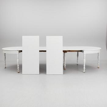 A mid 19th century dining table with six extension leaves.