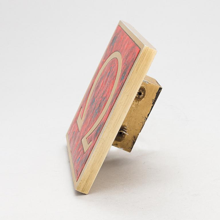 Omega, A door handle from latter half of the 20th century.