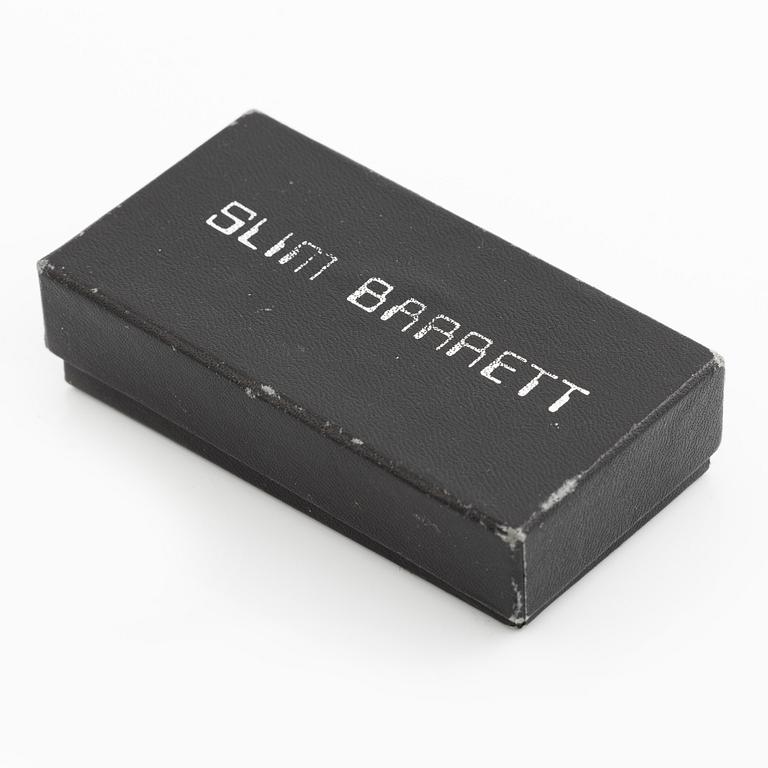 Earrings, possibly Slim Barrett.