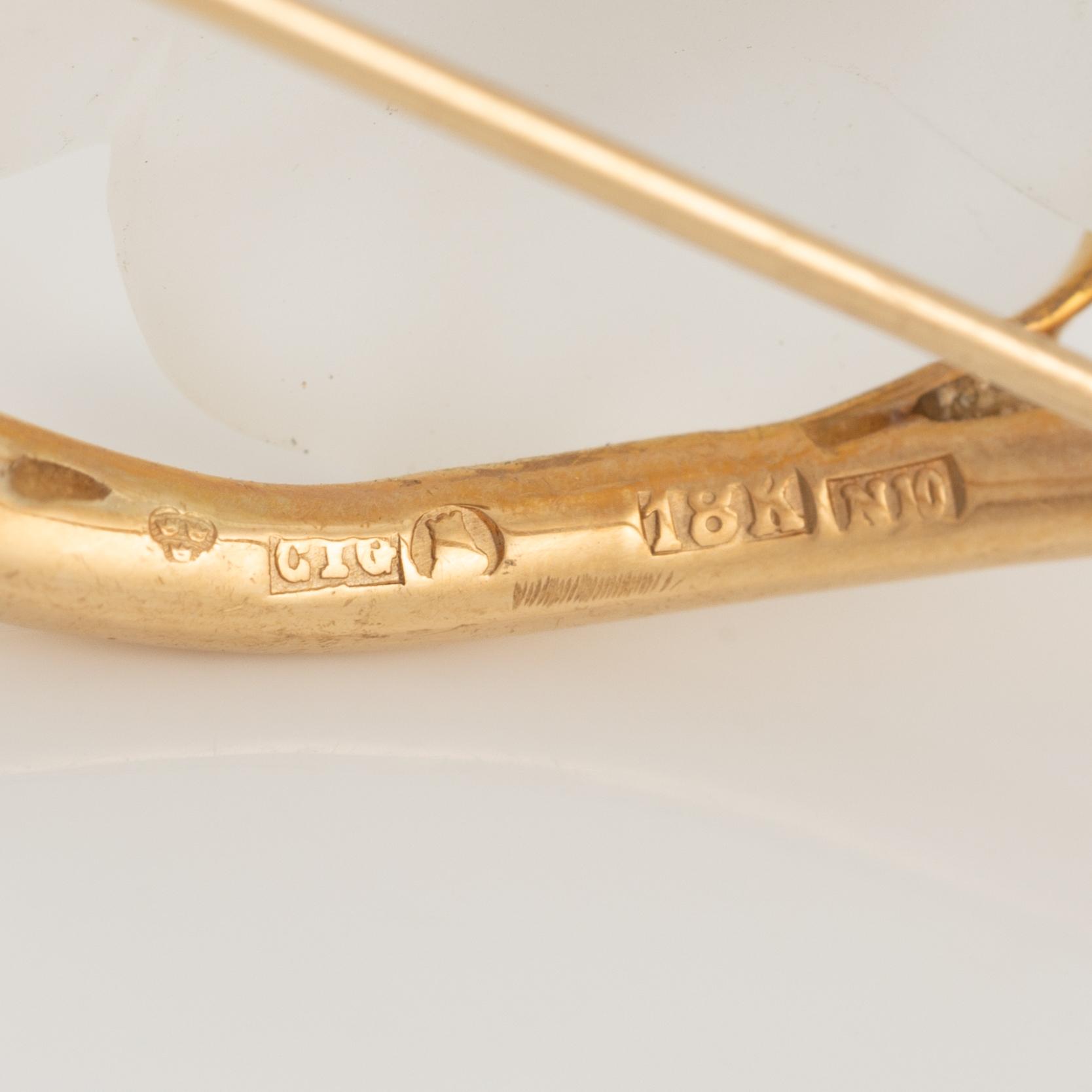 Brooch and earrings, floral, 18K gold with carved rock crystal and rose-cut diamonds.