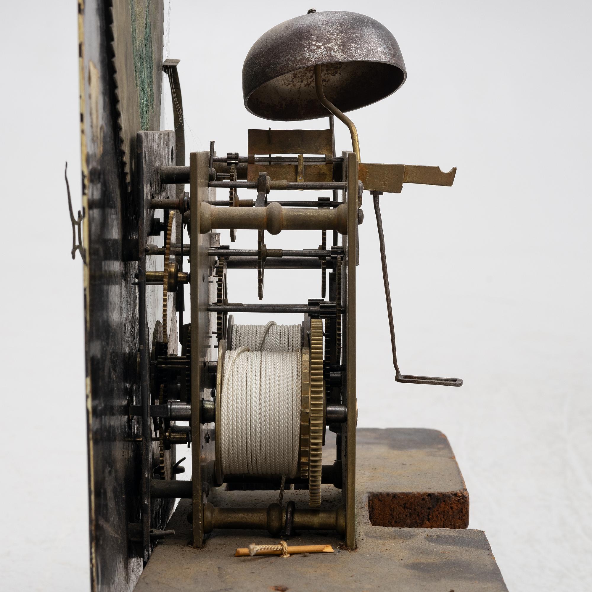 A long-case clock, England, 19th century.