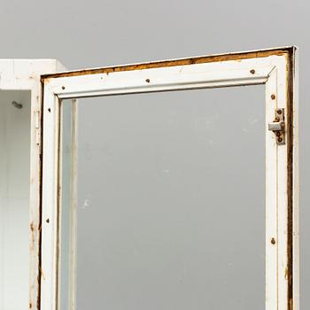 A metal doctor's cabinet, mid 20th century.