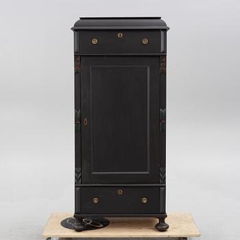 A cabinet, circa 1900.
