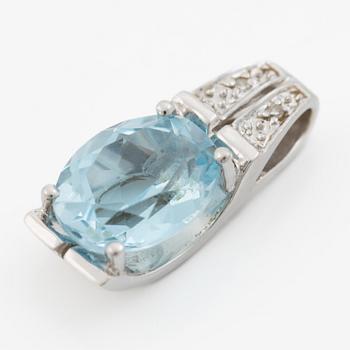Pendant in 18K gold with a topaz and small diamonds.