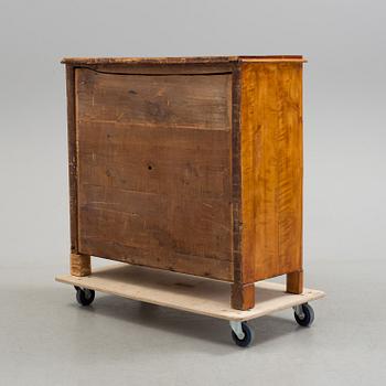 A second half of the 19th century birch veneered chest of drawer.