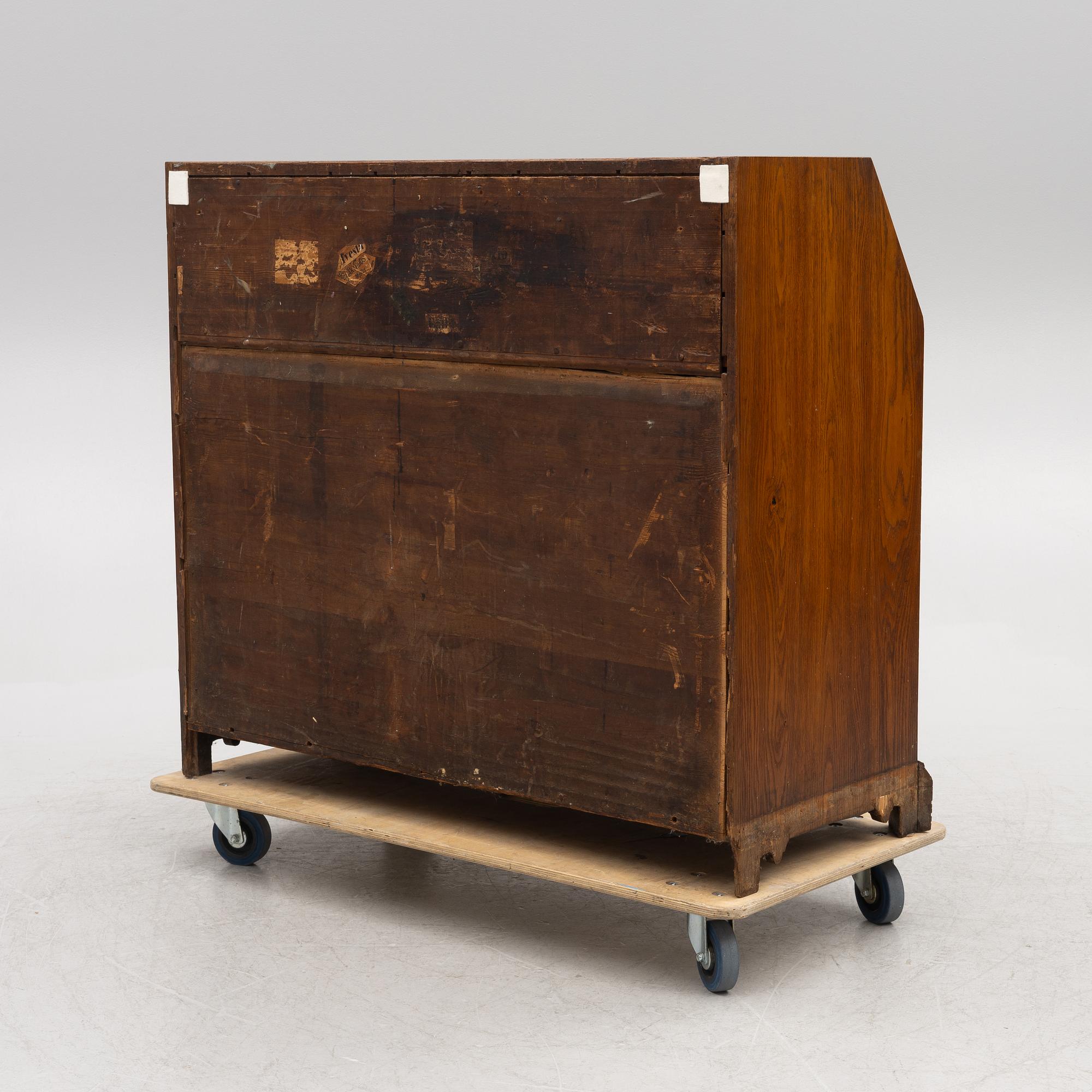 An oak secretaire, first half of the 19th century.
