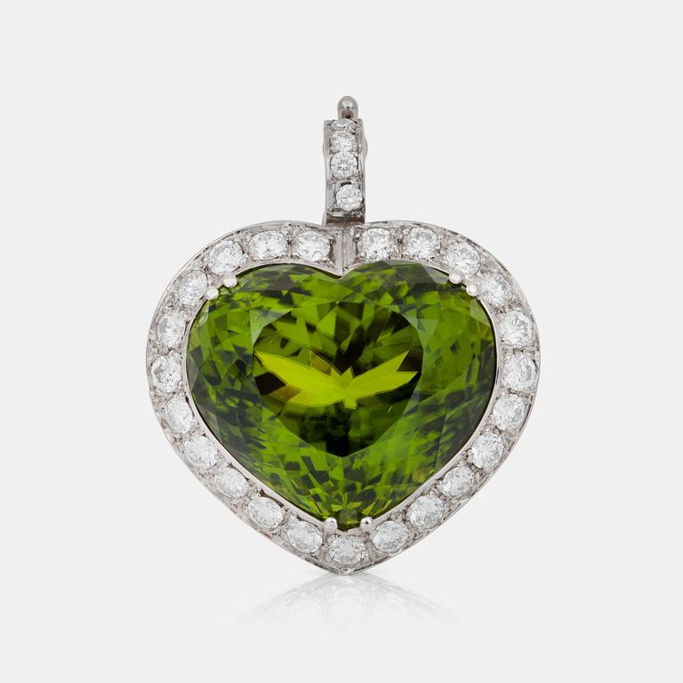 A circa 45.00 ct peridot and diamond pendant. Total carat weight of diamonds circa 1.50 cts.