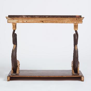 A Swedish Empire porphyry and giltwood console table, early 19th century.