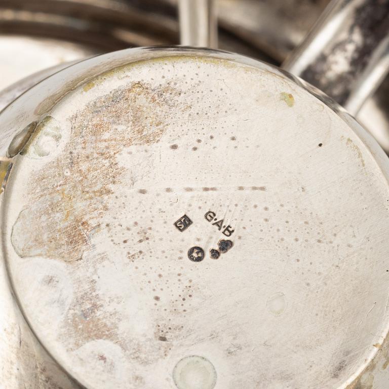 A Swedish 20th century silver tea-urn with stand and burner, marks of Guldsmedsaktiebolaget (GAB), Stockholm 1920.