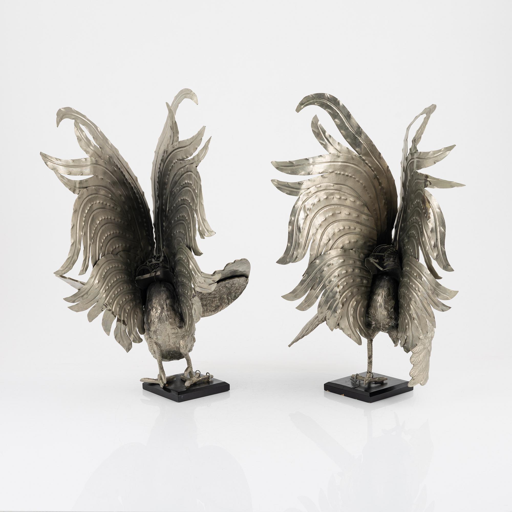 A pair of metal table decorations, 20th century.