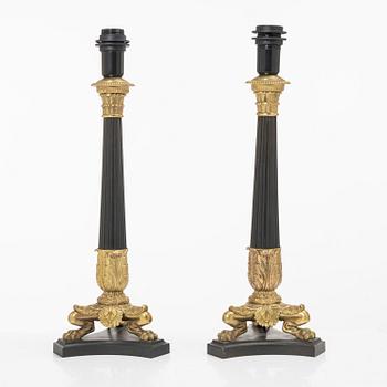 A pair of table lamps/reworked candle sticks, Empire, France, first half of the 20th century.