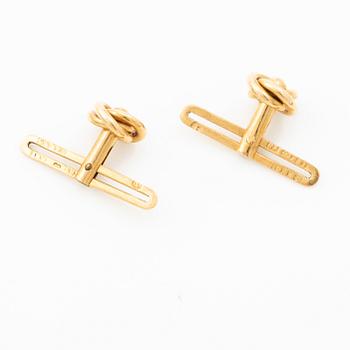 Shirt buttons, a pair and two cravat pins, 18K gold, with synthetic red stone and pearl.