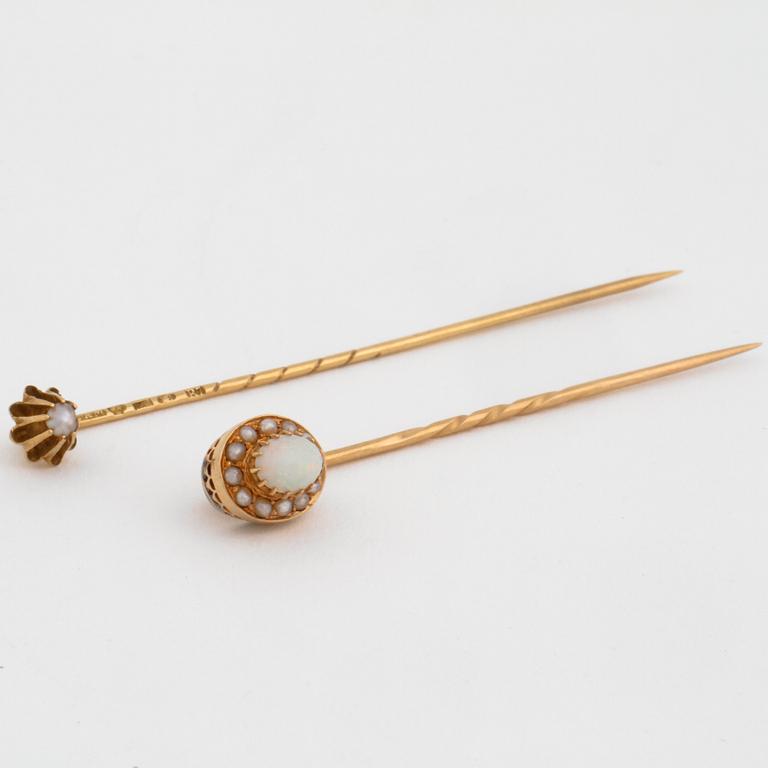 Three pin brooches.