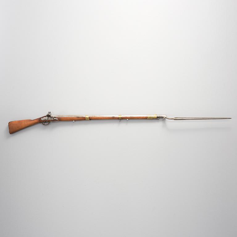 A flintlock rifle with bayonet early 19th century.