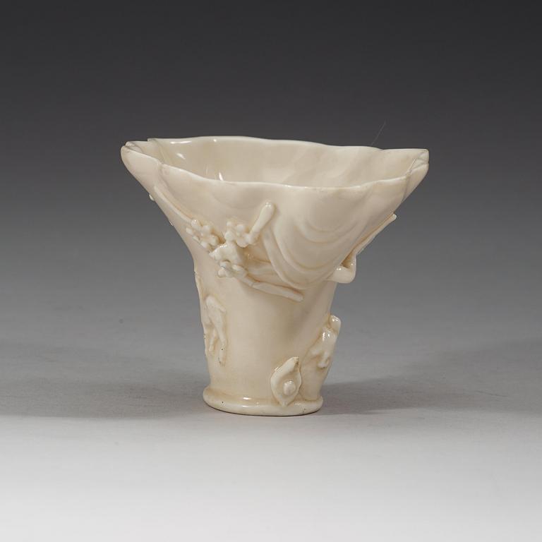 A blanc de chine rhinoserous libation cup, Qing dynasty, Kangxi (1662-1722).