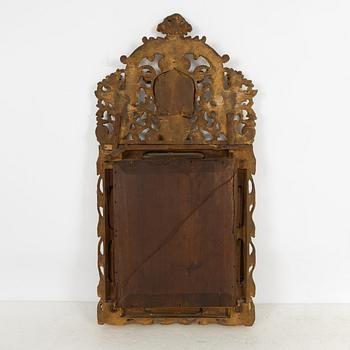 A South German Baroque carved giltwood mirror, early 18th century.