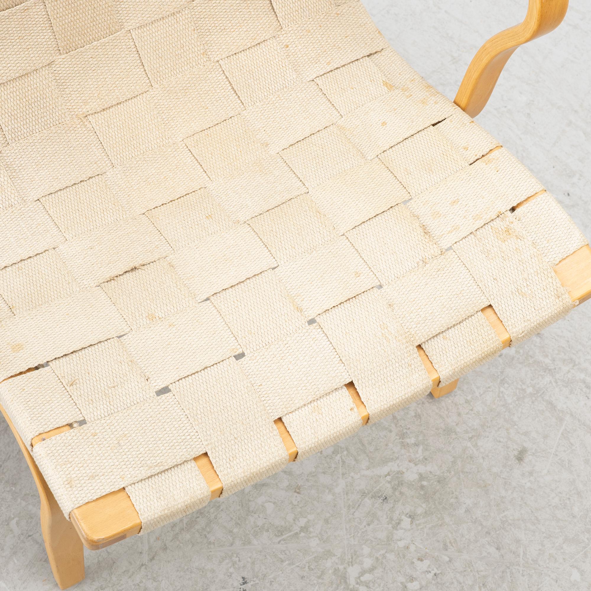 Bruno Mathsson, a pair of 'Eva' armchairs, DUX, Sweden, second half of the 20th century.