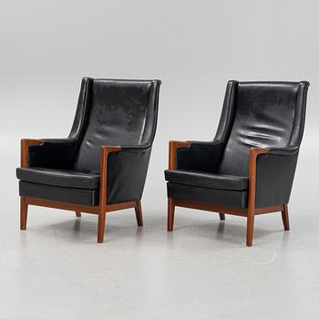 Karl Erik Ekselius, a pair of leather armchairs, JOC, Vetlanda, Sweden, 1960's.