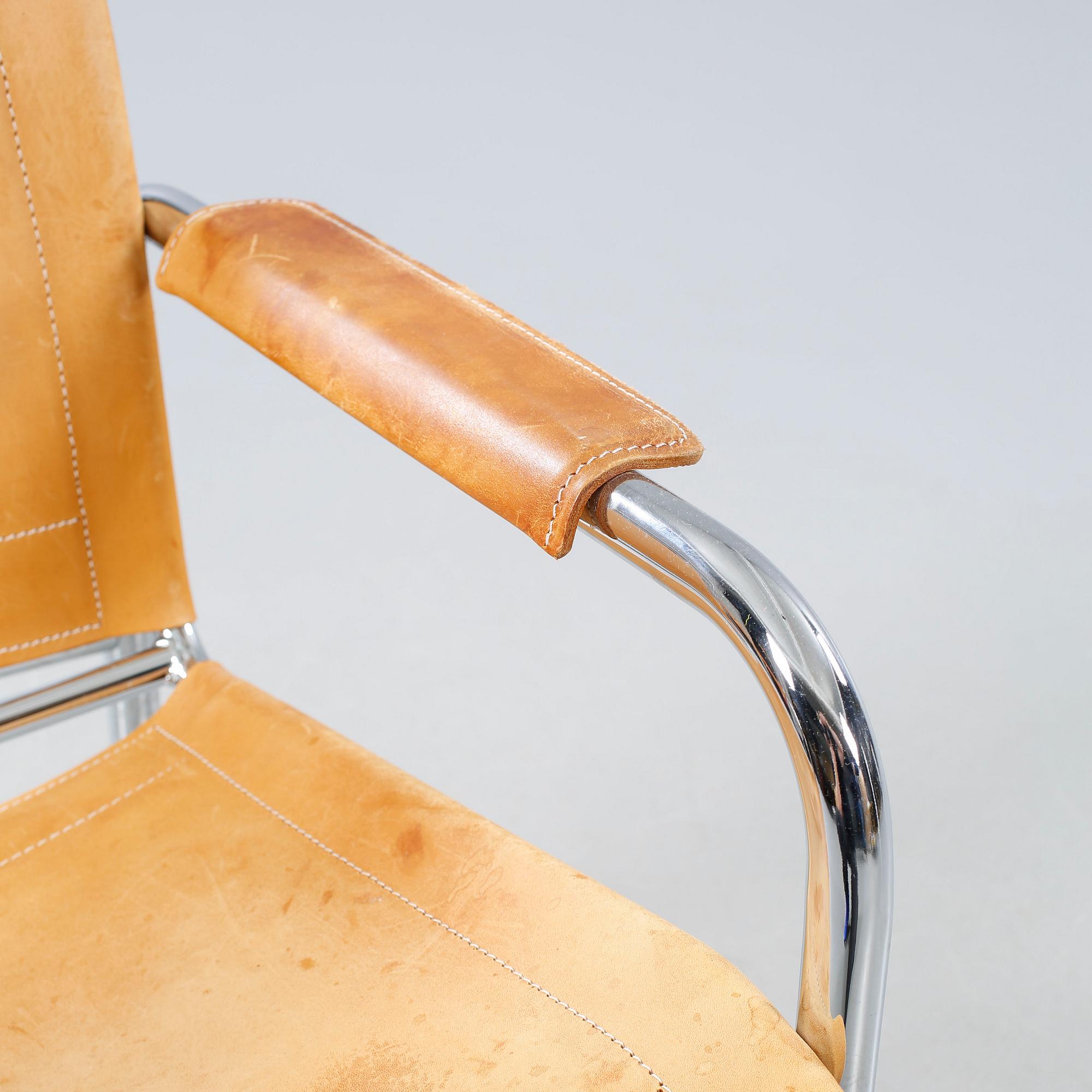 An armchair designed by Tord Björklund, named "Klinte" and made in the fourth quarter of the 20th century.