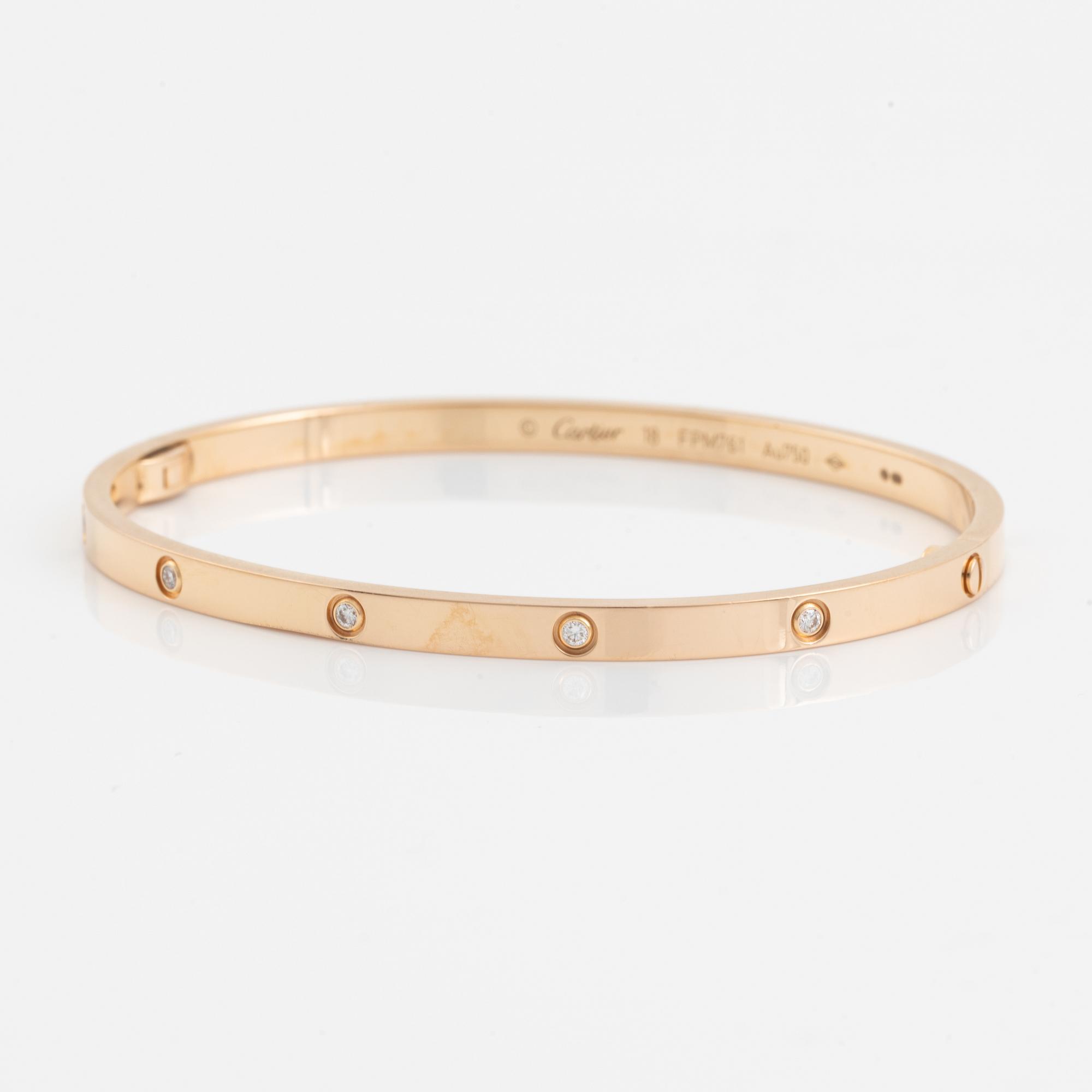 A Cartier "Love" bracelet small model in 18K rose gold with ten round brilliant-cut diamonds.