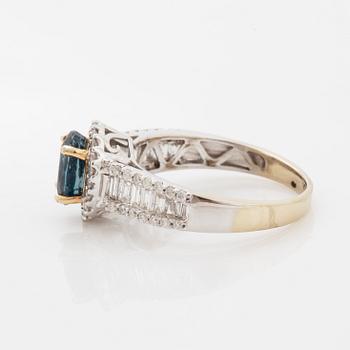 Oval faceted kyanite and diamond ring.