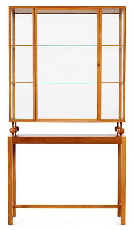 A Josef Frank walnut showcase cabinet by Svenskt Tenn, model 2077.