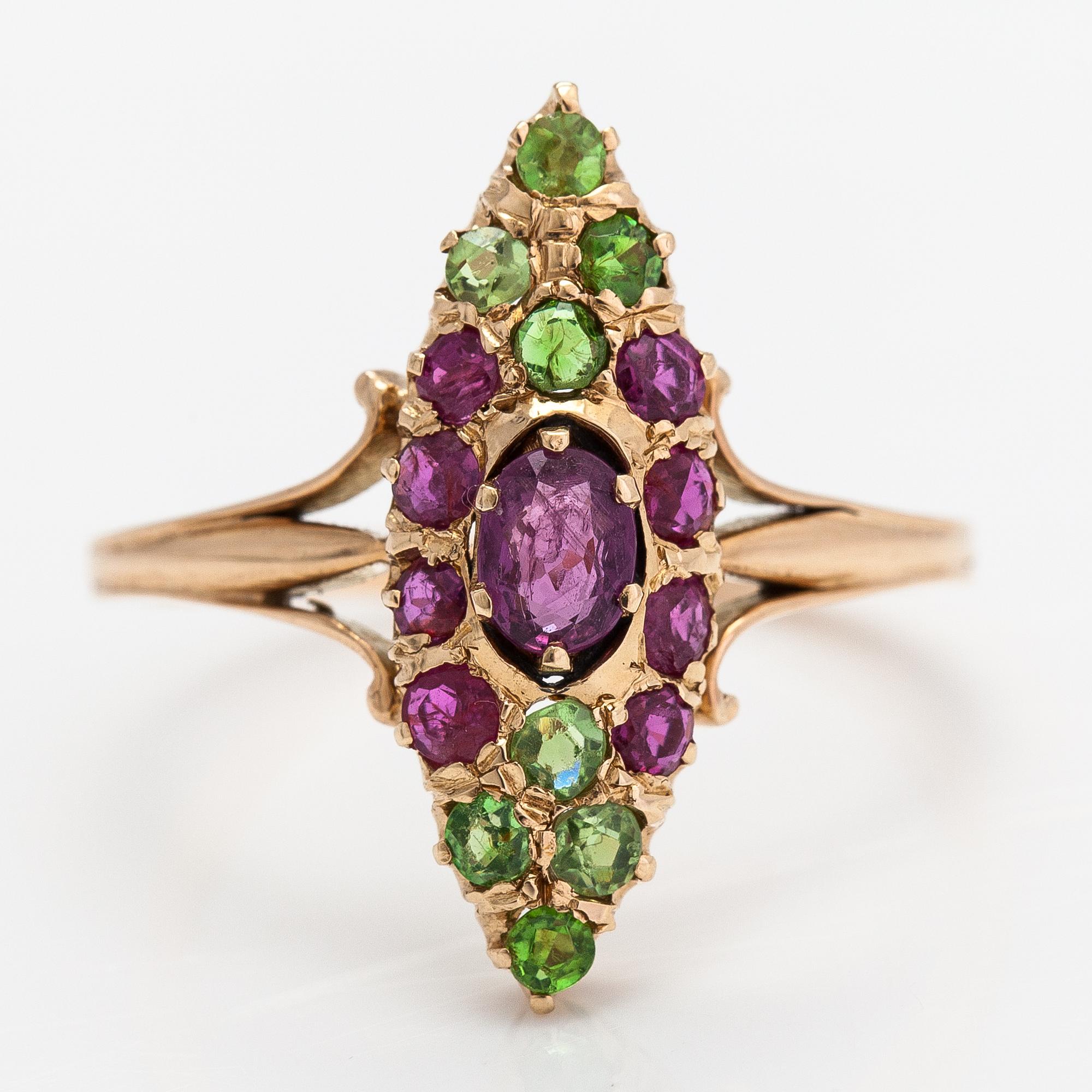 A 14K gold ring with rubies and demantoid garnets. Control marked Anton Vasilijevitch Richter, Astrakhan 1899-1916.