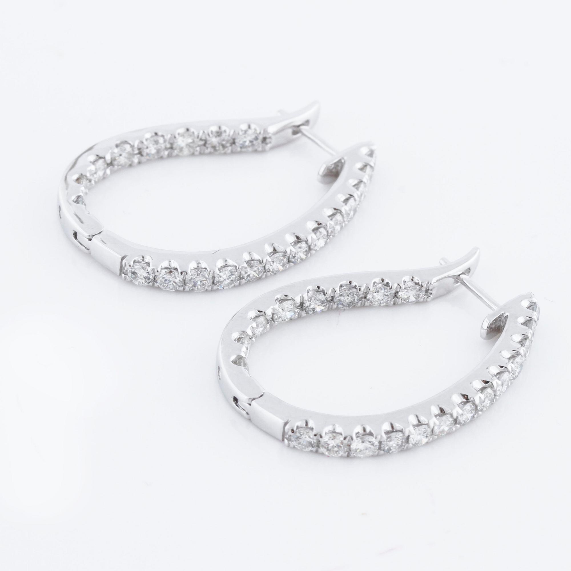 A pair of ca 1.90 cts brilliant cut diamond earrings.