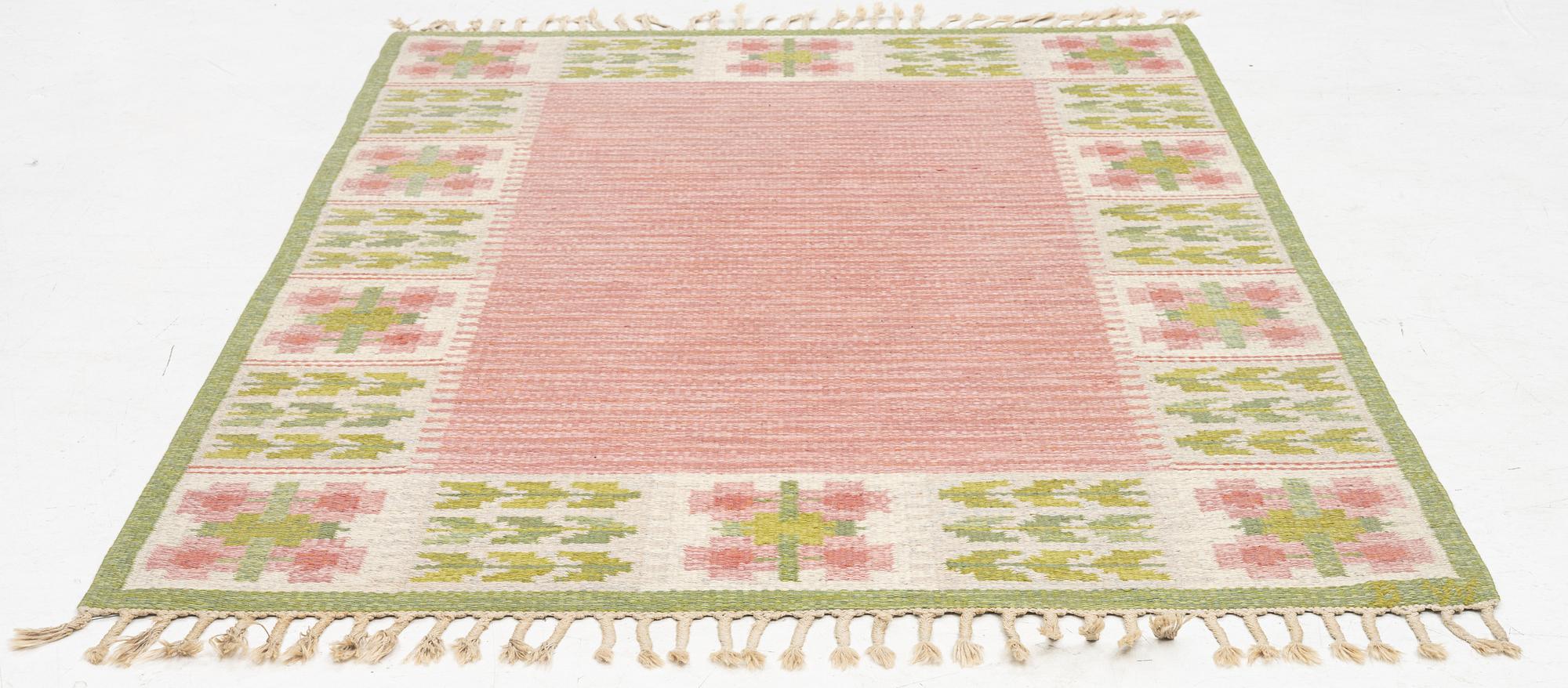 Berit Woelfer, a 'flora' flat weave rug, c. 203 x 136 cm, signed BW.