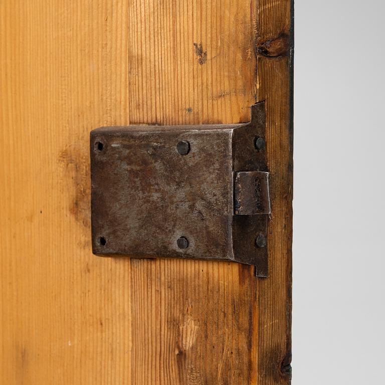 A folk art corner cabinet from Delsbo, Hälsingland, dated 1865.