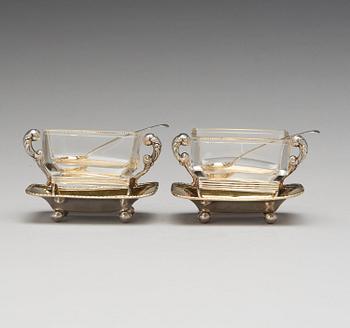 A pair of Swedish 19th century parcel-gilt silver and glass jelly-bowls, mark of Carl Tengstedt, Gothenburg 1839.