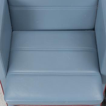 A pair of 1980s armchairs.