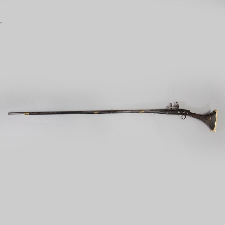 A NORTH AFRICAN FLINTLOCK GUN, 19th century.