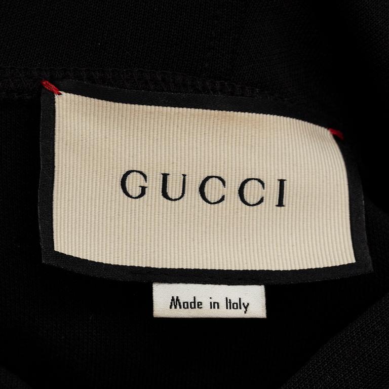 GUCCI, a polyester t-shirt and hoodie.