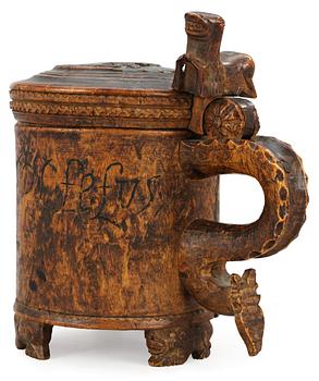 A Norwegian wooden tankard, dated 1741.