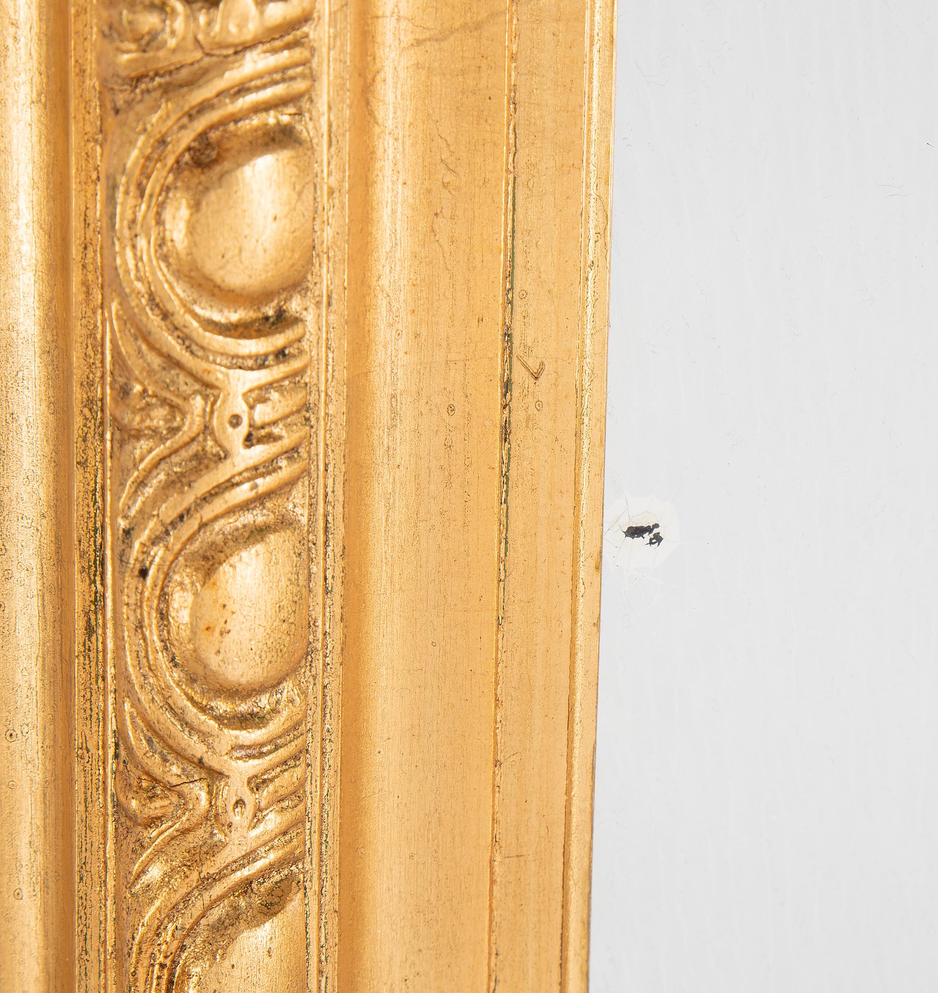 A mirror and console table from around the year 1900.