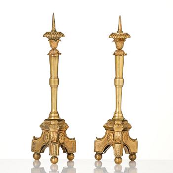 A pair of presumably Italian Empire ormolu candlesticks, early 19th century.