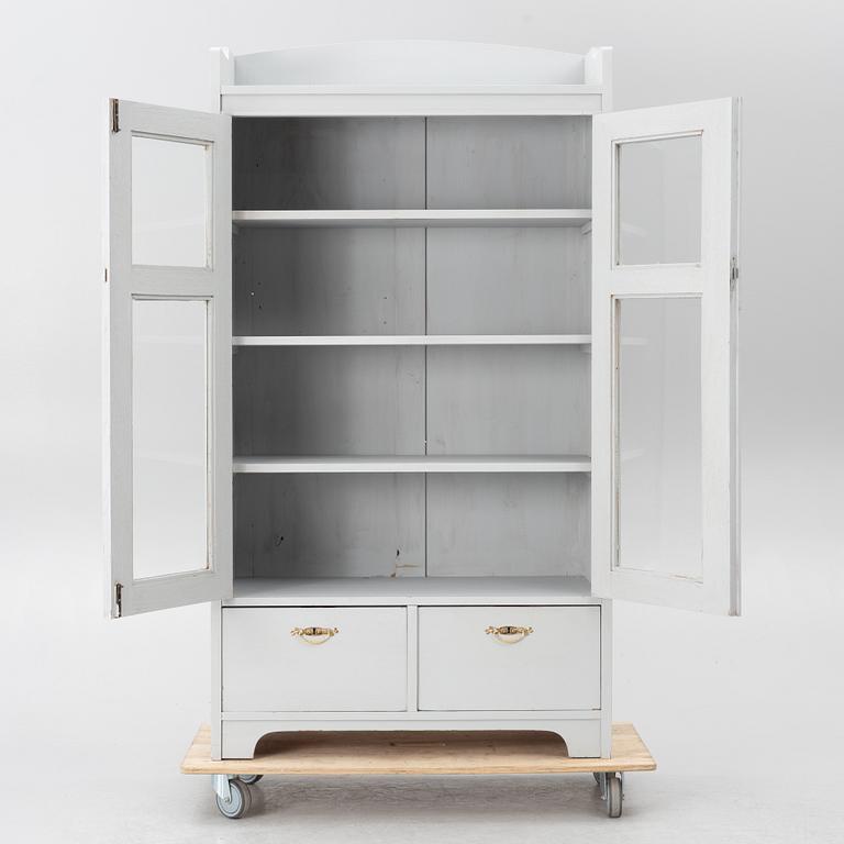 Display cabinet, early 20th century.